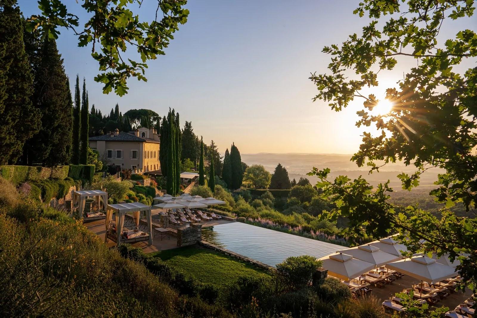The hotel and pool at sunset